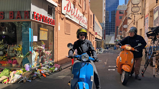 Members of the Vespa Club of Melbourne outside Pellegrini's on Sunday.
