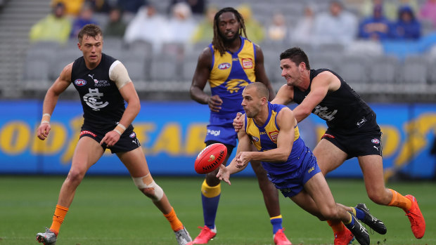 Point of difference: Eagles' Dom Sheed prepares to take a grab.