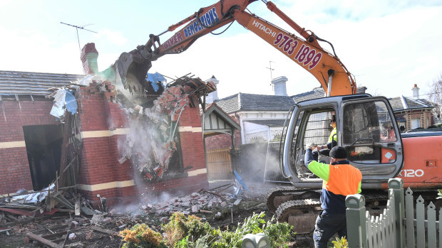 The Elsternwick home being demolished on Thursday.