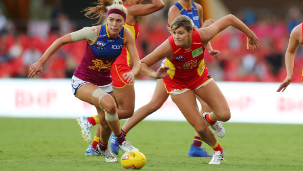 Orla O'Dwyer of the Lions and Lauren Bella of the Suns compete for the ball.
