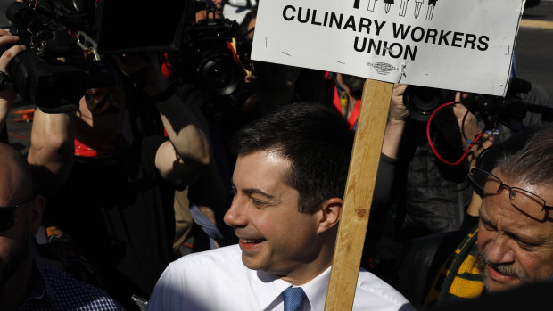 Pete Buttigieg walks in a picket line with Culinary Workers Union members outside the Palms Casino Resort in Las Vegas. So many Democratic presidential candidates showed up at the picket line that it could have doubled as a presidential forum.