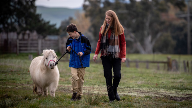 Will Callaghan walking the miniature ponies with MASS director Simone Reeves outside Mansfield. 