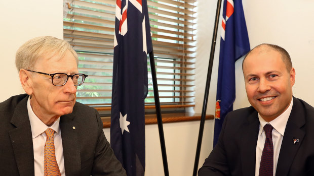Kenneth Hayne (left) hands over the final report from the banking royal commission to Treasurer Josh Frydenberg on February 1.