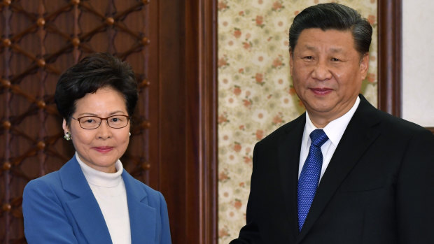 Hong Kong's leader Carrie Lam with Xi Jinping. Lam will have the power to pick judges in national security cases.