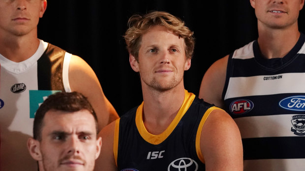 Rory Sloane (centre) says male and female players can work to help one another without tying their deals together. 