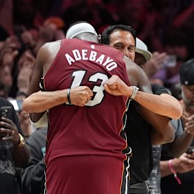 Miami Heat coach Erik Spoelstra hugs Adebayo after his astonishing game.