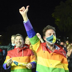 Spectators celebrate after Brisbane was announced the host of the 2032 Olympics.