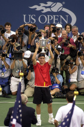 Hewitt holds the US Open mens singles trophy.