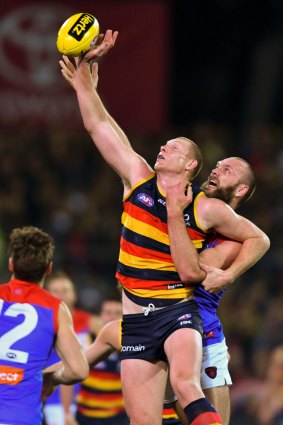 Sam Jacobs of the Crows and Max Gawn of the Demons do battle in the ruck.