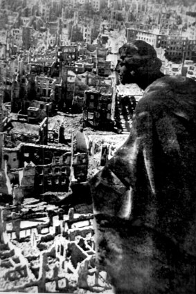 August Schreitmueller's sandstone sculpture The Goodness overlooks the destroyed city of Dresden from the Town Hall Tower in 1945.
