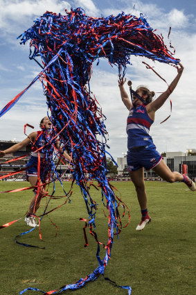 Western Bulldogs’ Brooke Lochland and captain Ellie Blackburn celebrate after winning the AFLW grand final in 2018.