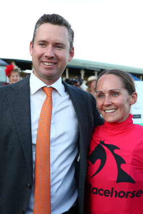 Trainer Adrian Bott celebrates with Rachel King after Just Fine’s win.