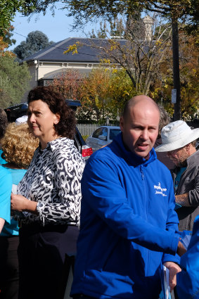 Josh Frydenberg and Monique Ryan hand out how-to-vote cards in Hawthorn before the federal election.