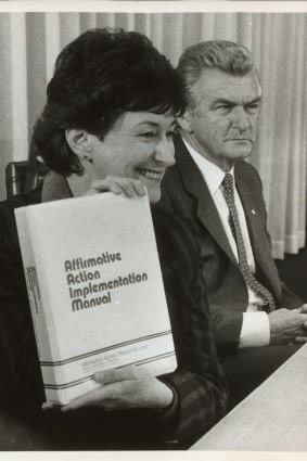 Senator Susan Ryan with Prime minister Bob Hawke as she holds the Affirmative action implementation manual.
