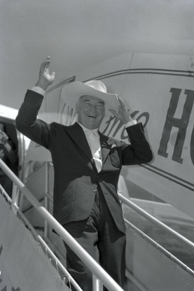 Hopalong Cassidy arrives at Essendon Airport on visit to Australia.