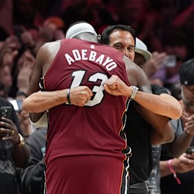 Miami Heat coach Erik Spoelstra hugs Adebayo after his astonishing game.