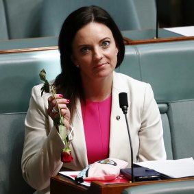 Labor MP Emma Husar with a rose during question time at Parliament House in Canberra.