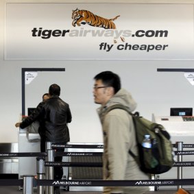 Passengers arrive to check in at the Tiger Airways terminal at Melbourne Airport.