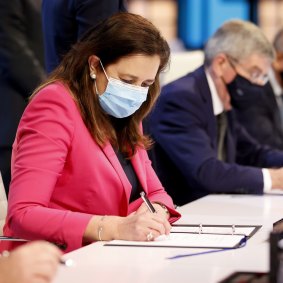 Queensland premier Annastacia Palaszczuk and IOC president Thomas Bach sign the agreement after Brisbane was announced as the 2032 Olympics host city.