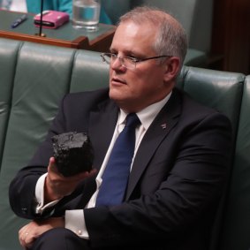 That was then, this is now ... the then treasurer, Scott Morrison, with a lump of coal during question time in Parliament in February 2017. 
