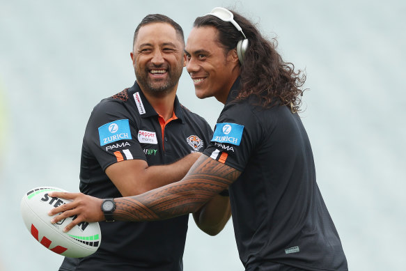 Jarome Luai shares a joke with Tigers coach Benji Marshall.