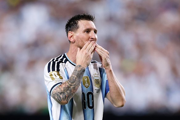 Messi celebrates his hat-trick.