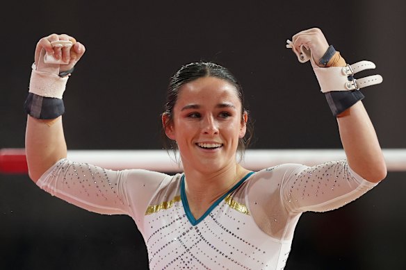 Kate McDonald celebrates her brilliant uneven bars routine.