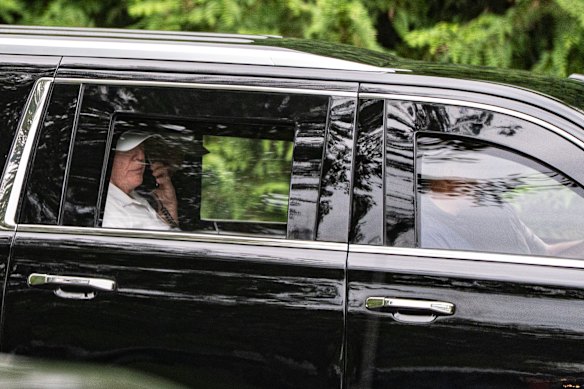 Trump returning from his golf club on Sunday.
