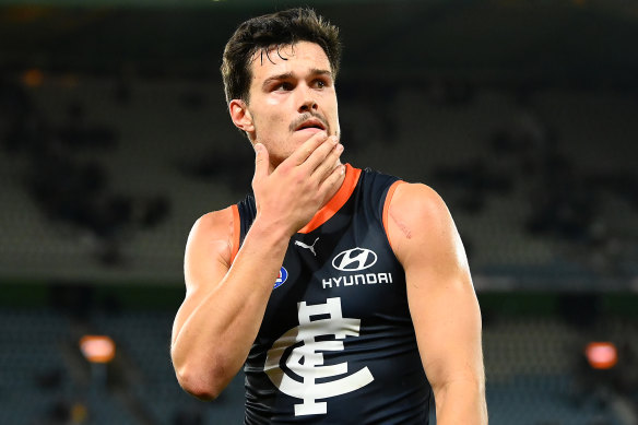 Jack Silvagni leaves the field after the loss to Brisbane, during which Blues fans voted with their feet last.