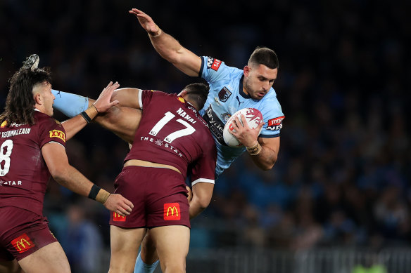 Ryan Matterson is tackled by Jeremiah Nanai in Origin I.