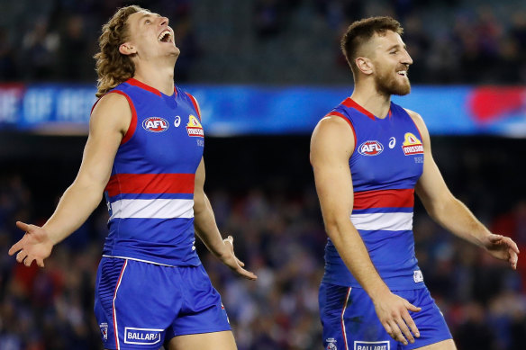 Bulldogs Aaron Naughton and Marcus Bontempelli celebrate during their round 10 trouncing of St Kilda.