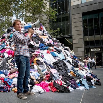 War on Waste host Craig Reucassel with six tonnes of fashion waste.