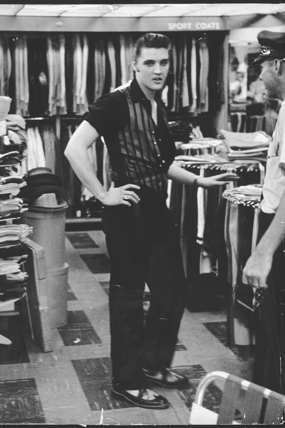 Elvis Presley shopping at Lansky’s clothing store on Beale Street, Memphis, 1956. The Bendigo exhibition charts the changing styles of the man who became “The King”.