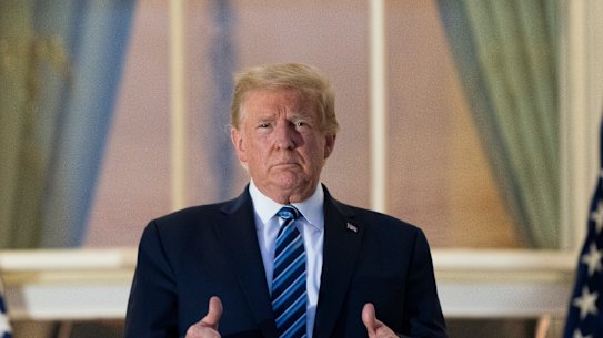 President Donald Trump gives thumbs up on the Blue Room Balcony.