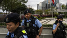 Police officers stand guard outside the Legislative Council in Hong Kong.