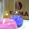 Restructure costs halve Sigma profit