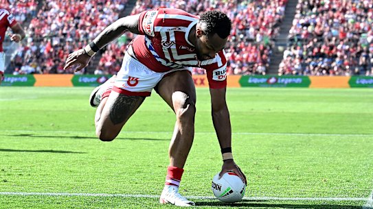 Hamiso Tabuai-Fidow of the Dolphins scores a try during the final round match.