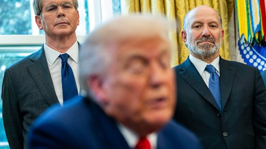Treasury Secretary Scott Bessent, left, and Commerce Secretary Howard Lutnick, right, in the Oval Office with President Trump this month. The three men are each worth billions of dollars.