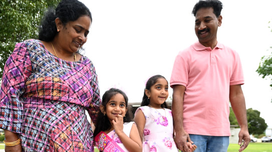 Tharnicaa Nadesalingam (2nd left) arrives for her fifth birthday party with her parents Priya and Nades and sister Kopika after their safe return to Biloela.