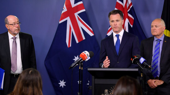 (From left to right) Former NSW Liquor and Gaming commissioner Michael Foggo, NSW Premier Chris Minns and NSW Minister for Gaming and Racing David Harris on Thursday.