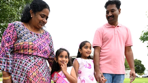 Tharnicaa Nadesalingam (2nd left) arrives for her fifth birthday party with her parents Priya and Nades and sister Kopika after their safe return to Biloela.