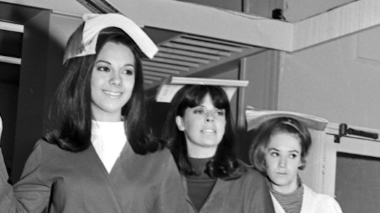 Students at the June Dally-Watkins School of Modelling in Sydney demonstrate how to walk tall.