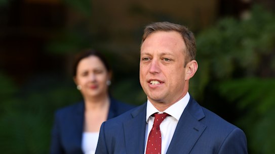 Queensland Minister for Health Steven Miles, watched by Premier Annastacia Palaszczuk, speaks during a press conference at Parliament House in Brisbane, Tuesday, May 5, 2020. Five new cases of COVID-19 have been detected in Queensland overnight. (AAP Image/Dan Peled) NO ARCHIVING