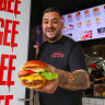 Mister Gee founder Gee Ozgen with a “Cheese Boogie Deluxe” at his restaurant in North Strathfield.