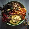 Sweet potato and kale bowl with quinoa, coriander tahini dressing and crispy chilli-lime chickpeas.