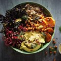 Sweet potato and kale bowl with quinoa, coriander tahini dressing and crispy chilli-lime chickpeas.