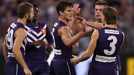 Lachie Schultz celebrates one of three goals in his side’s win over Carlton.