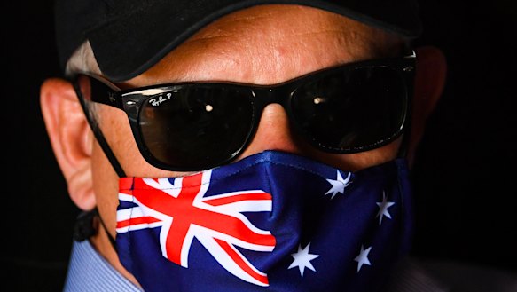 Australian Prime Minister Scott Morrison wears a face mask on a C-27 airplane after landing in Quilpie, Queensland, this week.
