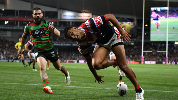 Bragging rights: Daniel Tupou opens the scoring for the Roosters in the first half.