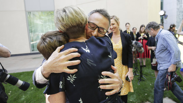 Di Natale embraces his children Luca and Ben and his wife Lucy after announcing his resignation.